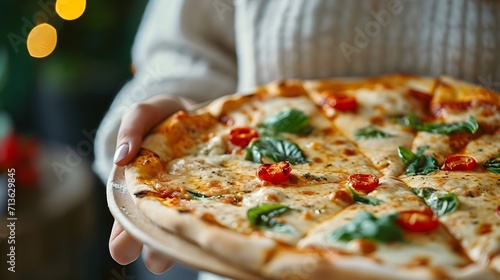 Close-up of a woman's hand holding a delicious pizza, background image, generative AI