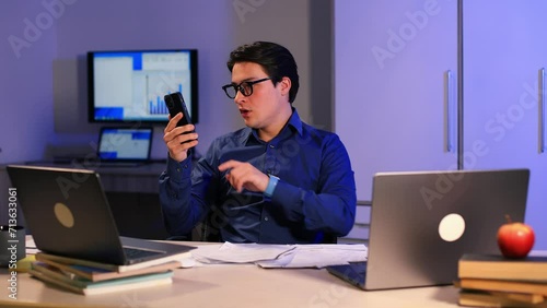 business man talking mobile phone night evening office check documents working 