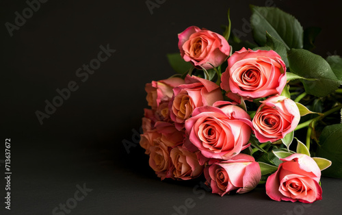 Bouquet of roses on a black background with copy space