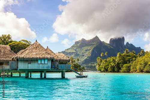 Overwater bungalows in the lagoon of Bora Bora, French Polynesia