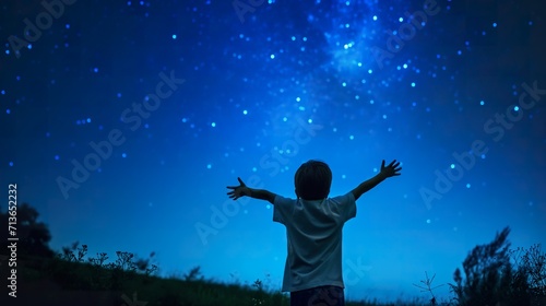Child observes the stars and constellations in the night sky  beautiful and aspirational. natural background.