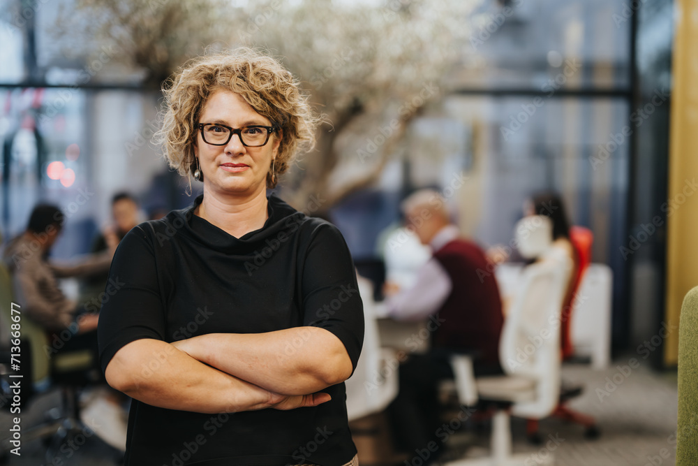 A confident and successful businessperson standing in a modern office. The executive is proud and satisfied with their job, portraying professionalism and positivity.