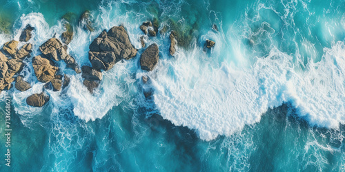 Beautiful seaside waves A vertical overhead image shows rocks being struck by waves.AI Generative photo