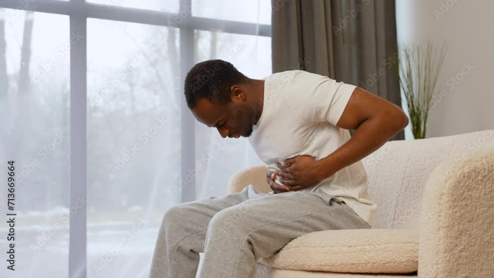Black man with stomach pain, pain in abdomen Black man with stomach pain, pain in abdomen