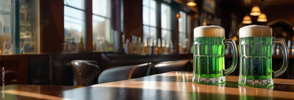 Beer mug banner with green beer on Irish pub wooden table, defocused st. Patrick's day pub interior background with copy space