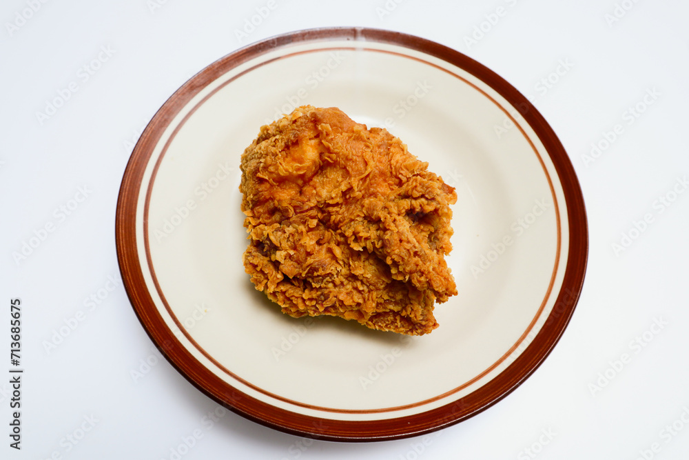 fried chicken on a plate, isolated over white background fried chicken on a plate, isolated over white background