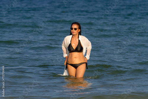 Woman body pretty with black  bikini on beach © suthin3