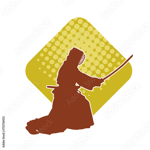 Silhouette of a kungfu or wushu martial art athlete in action pose. Silhouette of a male martial art person in pose with swords weapon.
