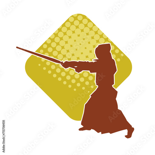 Silhouette of a kungfu or wushu martial art athlete in action pose. Silhouette of a male martial art person in pose with swords weapon.
