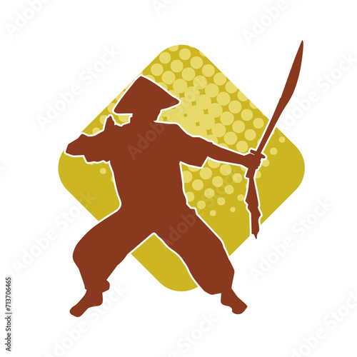 Silhouette of a kungfu or wushu martial art athlete in action pose. Silhouette of a male martial art person in pose with swords weapon.
