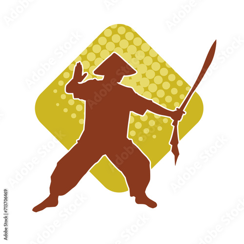 Silhouette of a kungfu or wushu martial art athlete in action pose. Silhouette of a male martial art person in pose with swords weapon.
