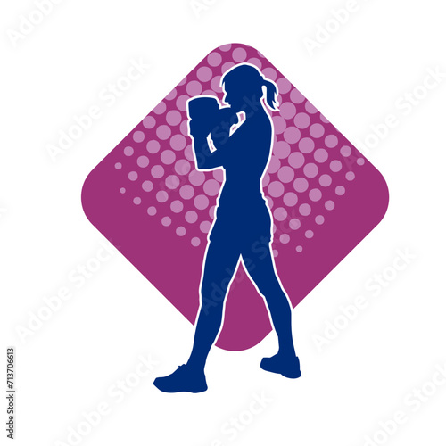 Silhouette of woman boxing athlete in action pose. Silhouette of a female wearing boxing gloves for boxing sport.