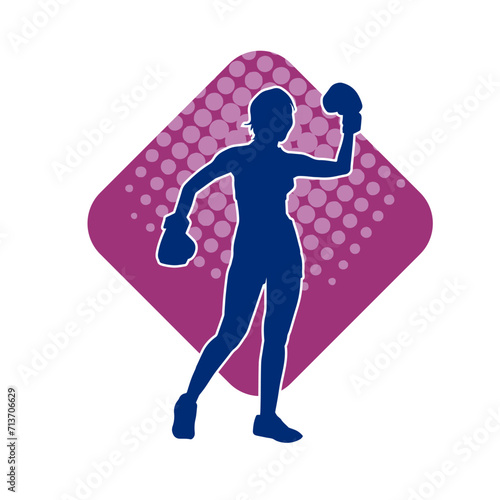 Silhouette of woman boxing athlete in action pose. Silhouette of a female wearing boxing gloves for boxing sport.