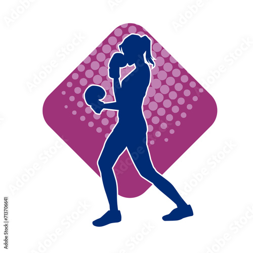 Silhouette of woman boxing athlete in action pose. Silhouette of a female wearing boxing gloves for boxing sport.