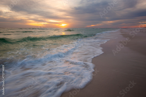 A scenic sunset view of Gulf Island National Seashore in Pensacola, Florida. 