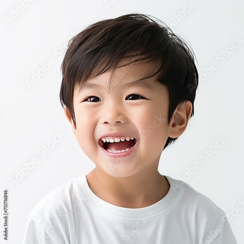  A Close up shoot of Smiling Asian Child with white teeth on white background for teeth and toothpaste ads