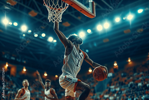 "Championship Soar: Athletic Multiethnic Player Dashing for a Slam Dunk in a Packed Arena, Intense College Basketball Tournament Action"  © Abhiraj