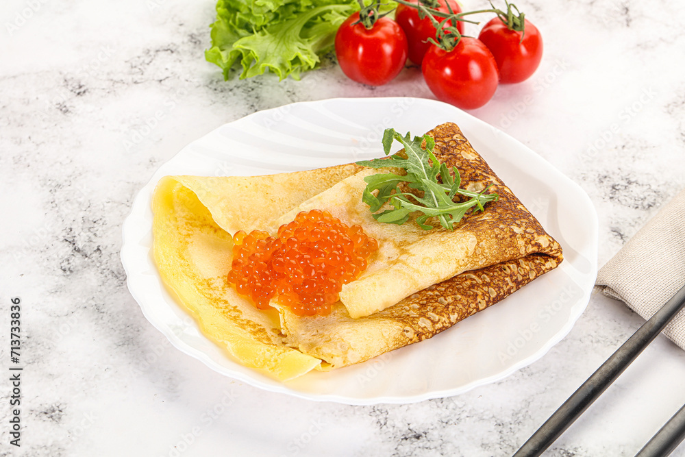 Russian pancake with red caviar Russian pancake with red caviar