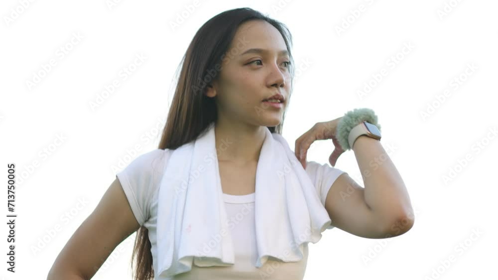 A female runner warms up and stretching before jogging in the park. A female runner warms up and stretching before jogging in the park.