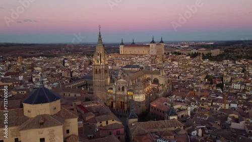 Toledo, Spain: Cinematic aerial drone footage of the cathedral and the 16th century Alcazar palace in Toledo old town in the Castilla-La Mancha in central Spain at sunset photo