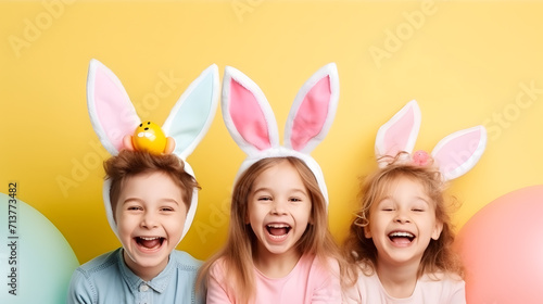Happy children in bunny ears celebrating easter