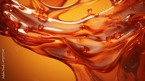 A liquid wave of clear oil. A bright splash of orange liquid. Abstract shining background for design. photo