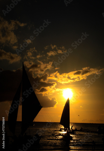 sailboat at sunset (ID: 713786864)