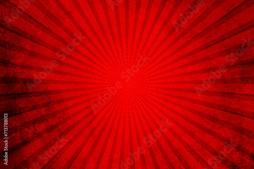 Red grunge background with sunburst. Red rays background
