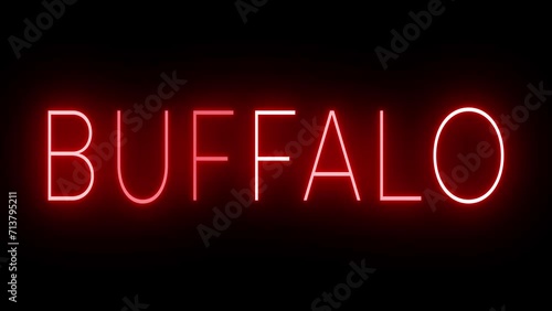 Flickering red retro style neon sign glowing against a black background for BUFFALO