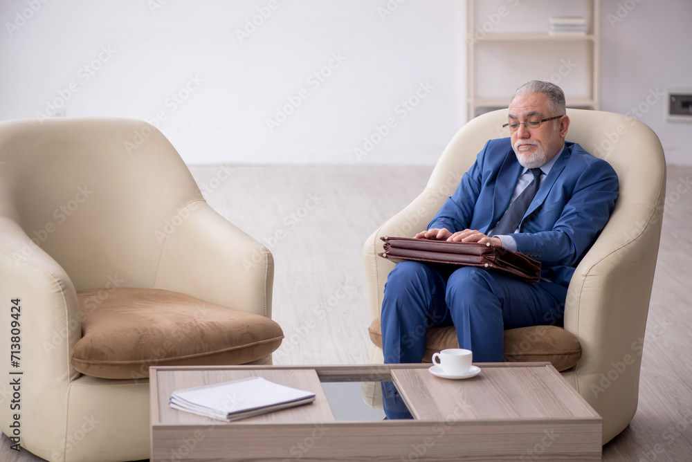 Old businessman waiting for business meeting Old businessman waiting for business meeting