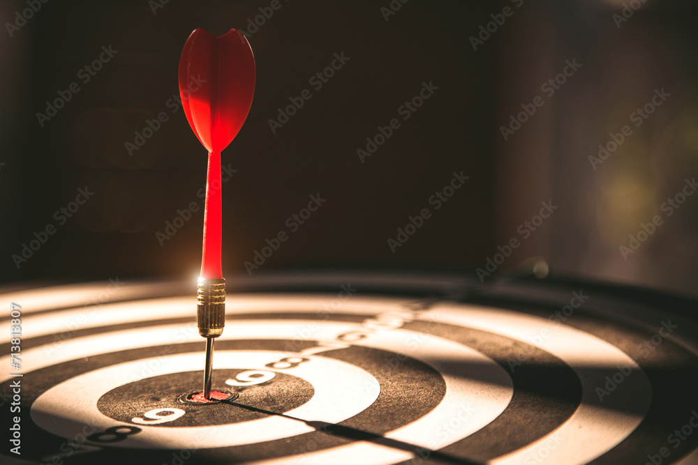 Bullseye target goal or dartboard has dart arrow throw hitting center shooting for financial business targeting planning to winner concept. Bullseye target goal or dartboard has dart arrow throw hitting center shooting for financial business targeting planning to winner concept.