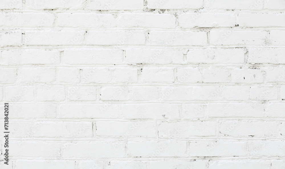 White brick wall background. Old brick wall texture with white cracked paint. Abstract white brick wall wallpaper design. Close up. White brick wall background. Old brick wall texture with white cracked paint. Abstract white brick wall wallpaper design. Close up.