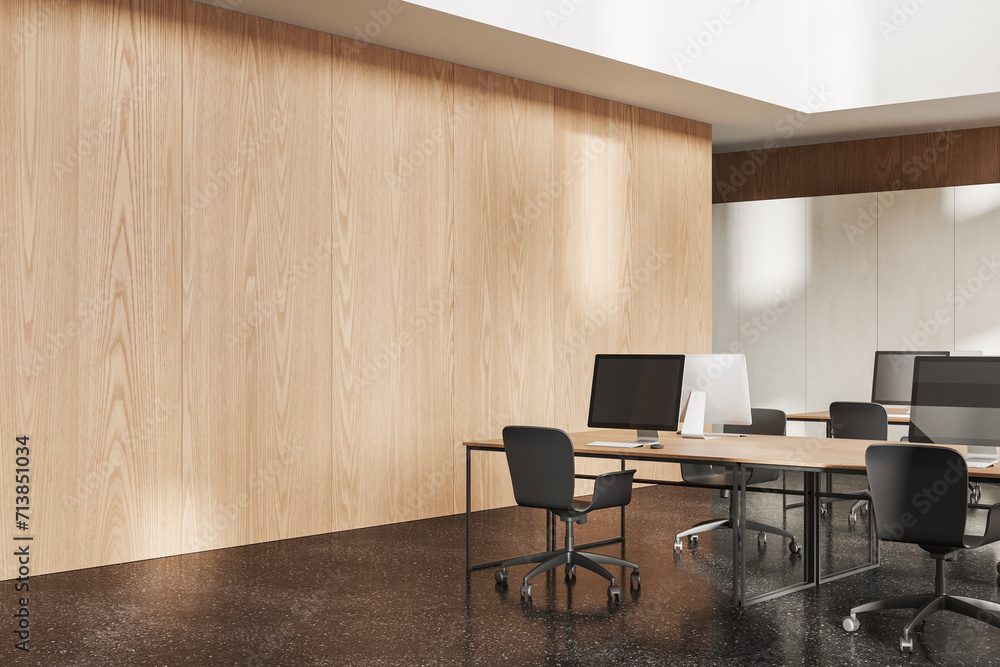 Minimalist coworking interior with pc desktop on shared table, empty wall Minimalist coworking interior with pc desktop on shared table, empty wall