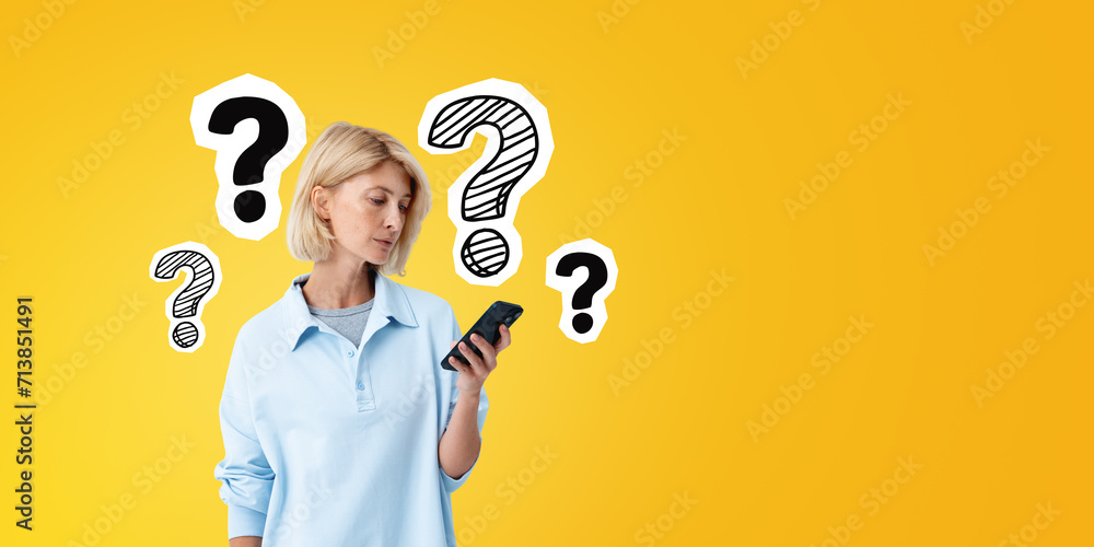 Young woman with phone in hand, question marks sketch on empty background - obrazy, fototapety, plakaty 