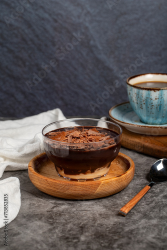 Supangle dessert. Spangle and chocolate pudding in bowl on dark background photo