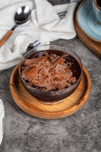 Supangle dessert. Spangle and chocolate pudding in bowl on dark background. Close up photo