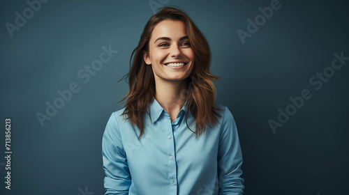 Caucasian woman wearing a shirt on a blue background.