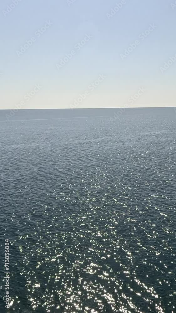 Sea water surface. Aerial view, camera flies over clear sea water. Nobody. Holiday recreation concept. Abstract nautical summer ocean nature. Slow motion. Close up. Vertical video Sea water surface. Aerial view, camera flies over clear sea water. Nobody. Holiday recreation concept. Abstract nautical summer ocean nature. Slow motion. Close up. Vertical video