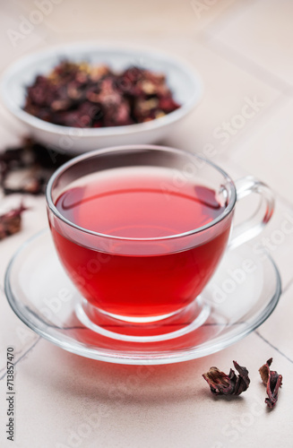 Hibiscus tea in glass mug.