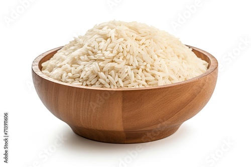 Raw dehydrated rice in a wooden bowl alone on a white surface