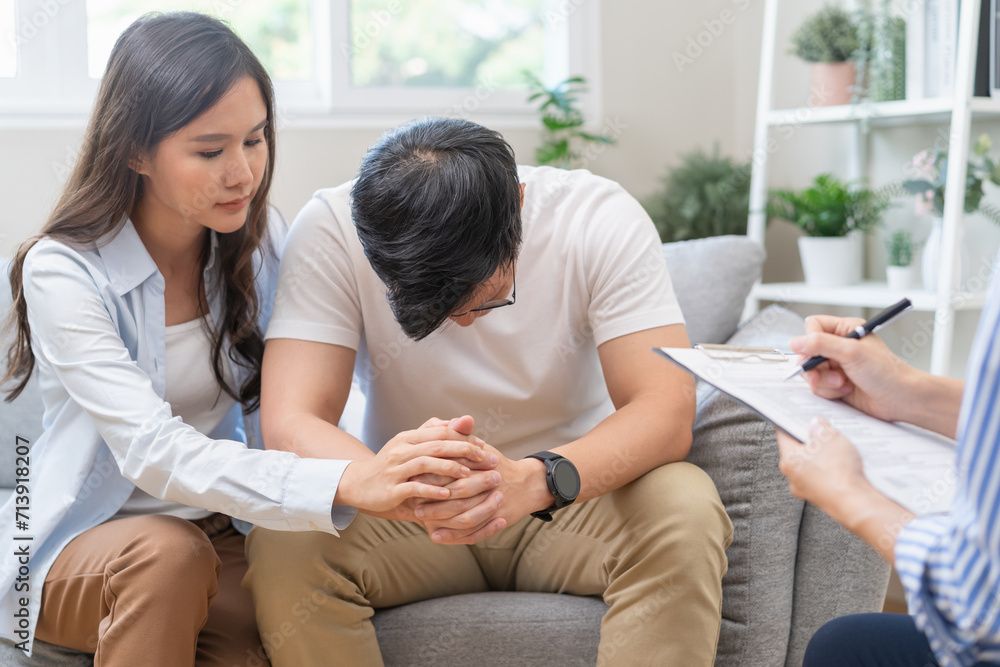 psychologist talking with a couple during mental therapy. psychologist talking with a couple during mental therapy.