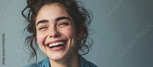 Dental health care concept picture happy excited beautiful woman in blue cloth show white toothy smile Portrait image of brunette girl isolate over grey gray background wide banner ad copy spac