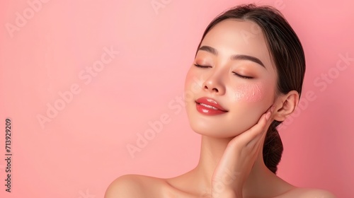 Beautiful young Asian woman with clean fresh skin on pink background  Face care  Facial treatment  Cosmetology  beauty and spa.