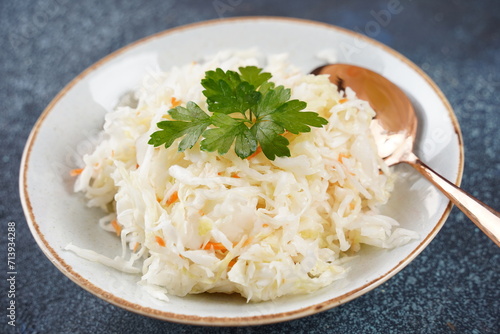Sauerkraut - fermented cabbage with carrot in the bowl