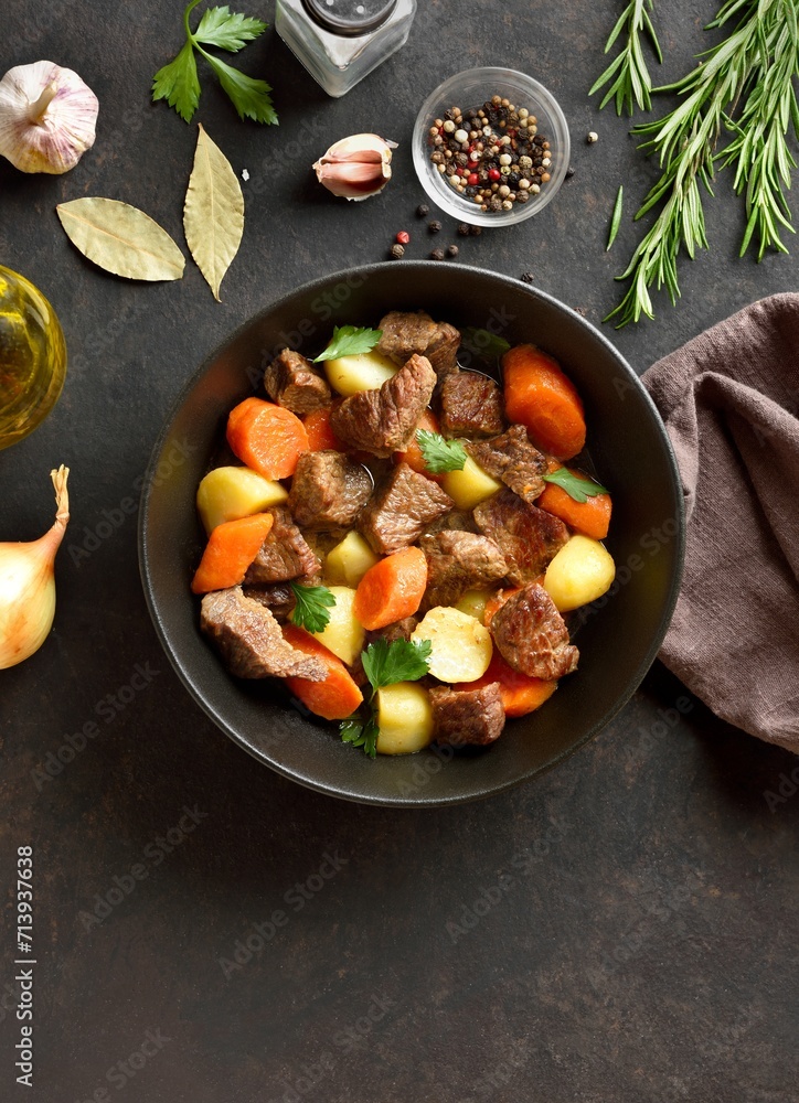 Beef stew with potatoes, carrots and greens