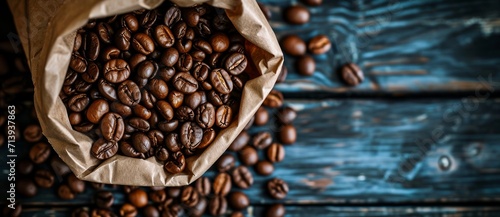 A rustic bag of kona coffee beans, rich with the aroma of caffeine and hints of cocoa, awaits to be brewed in the warm comfort of an indoor wooden kitchen photo