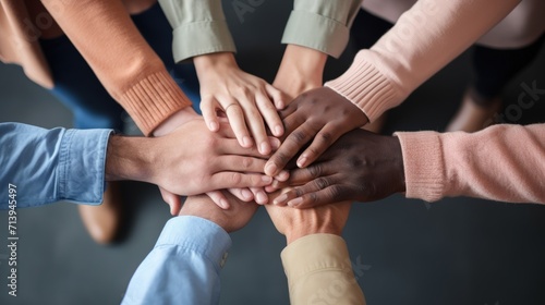 Group of multiethnic people holding hands together. Teamwork concept Generative AI