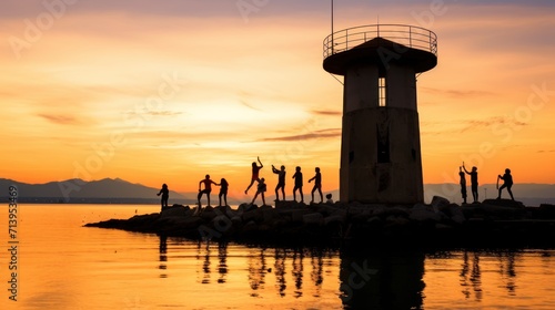 Geneva, Switzerland, Europe - Paquis Beach on Lake Geneva, silhouettes of people on the jumping tower. Suwasana in the afternoon at sunset.