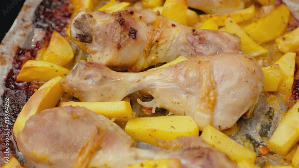 Roasted chicken drumsticks and potato wedges on a pan, freshly cooked and steaming in the oven. This scene depicts the completion of a roast meal, ideal for a cooking channel or recipe website feature Roasted chicken drumsticks and potato wedges on a pan, freshly cooked and steaming in the oven. This scene depicts the completion of a roast meal, ideal for a cooking channel or recipe website feature