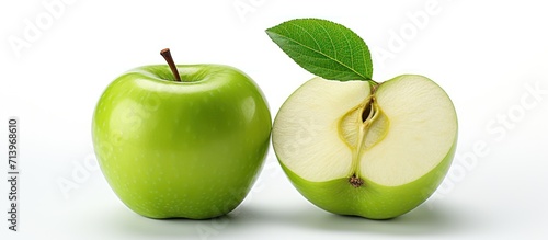 Fresh green apple and half slice isolated on white background
